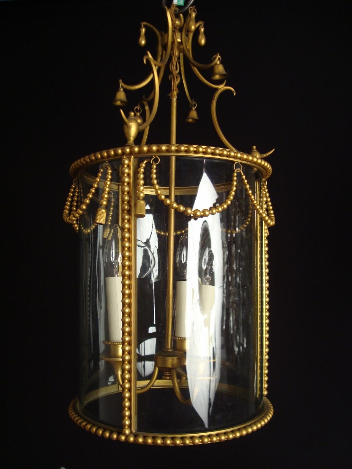 A gilt brass drum lantern