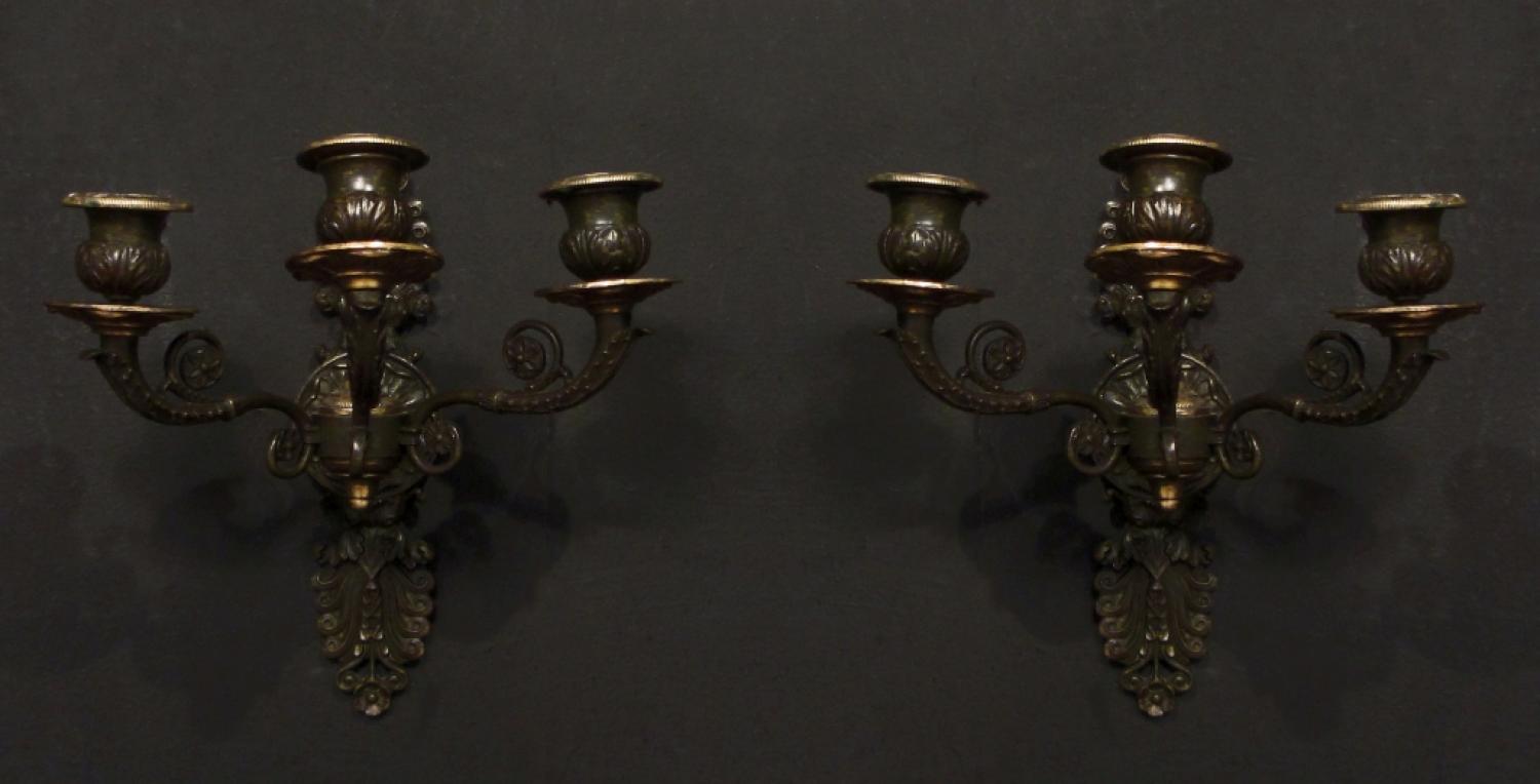 A pair of gilt patinated bronze wall lights