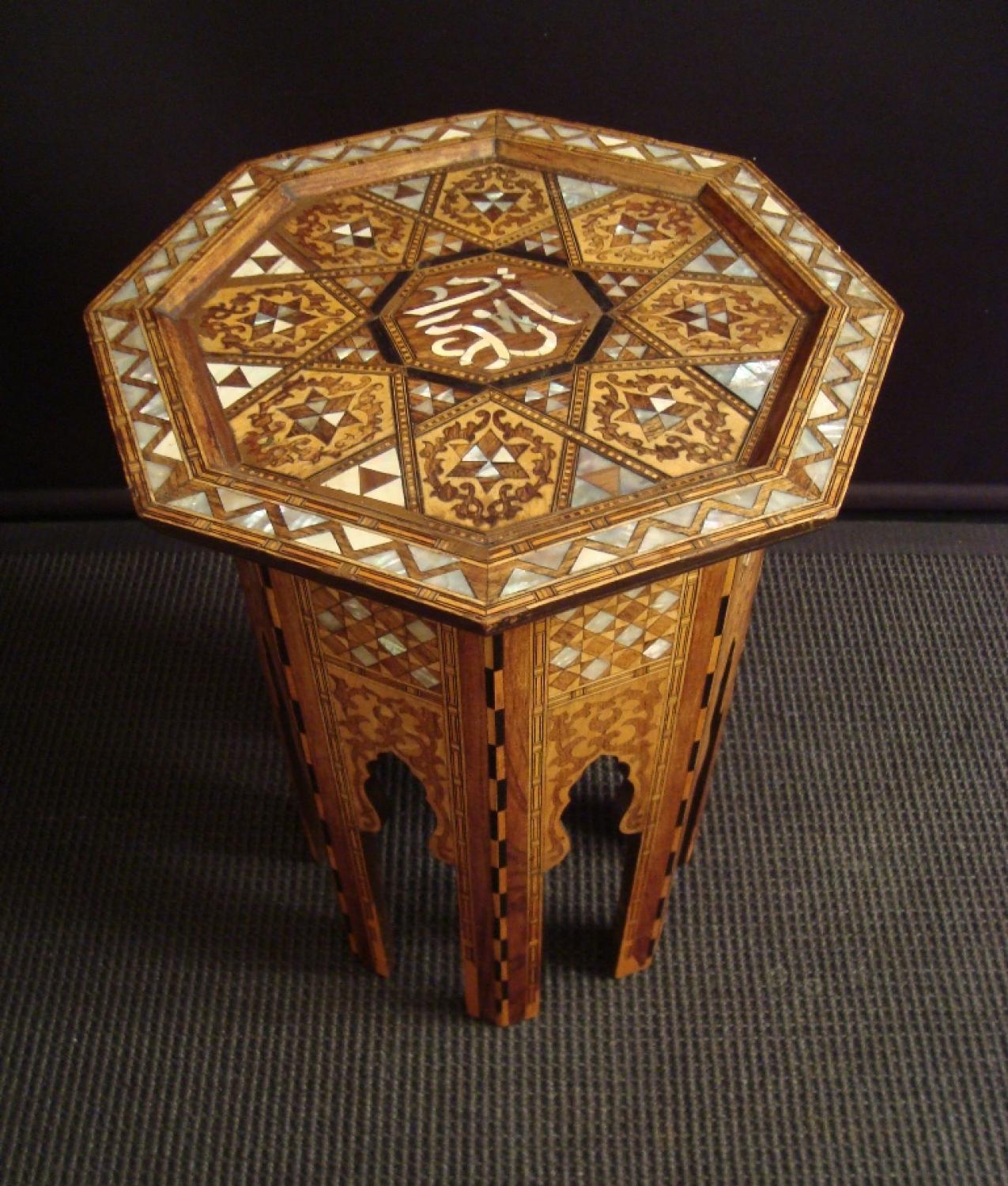 A mother of pearl and hardwood inlaid table