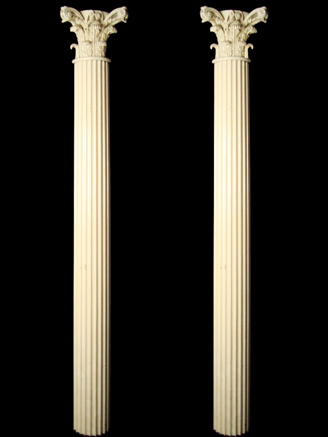 A pair of white painted carved wood pilasters