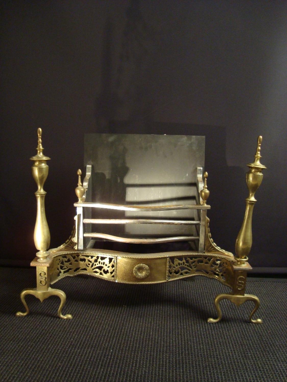 A Georgian style brass fire basket