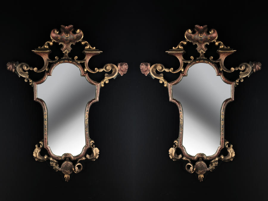 A pair of carved beech wood mirrors