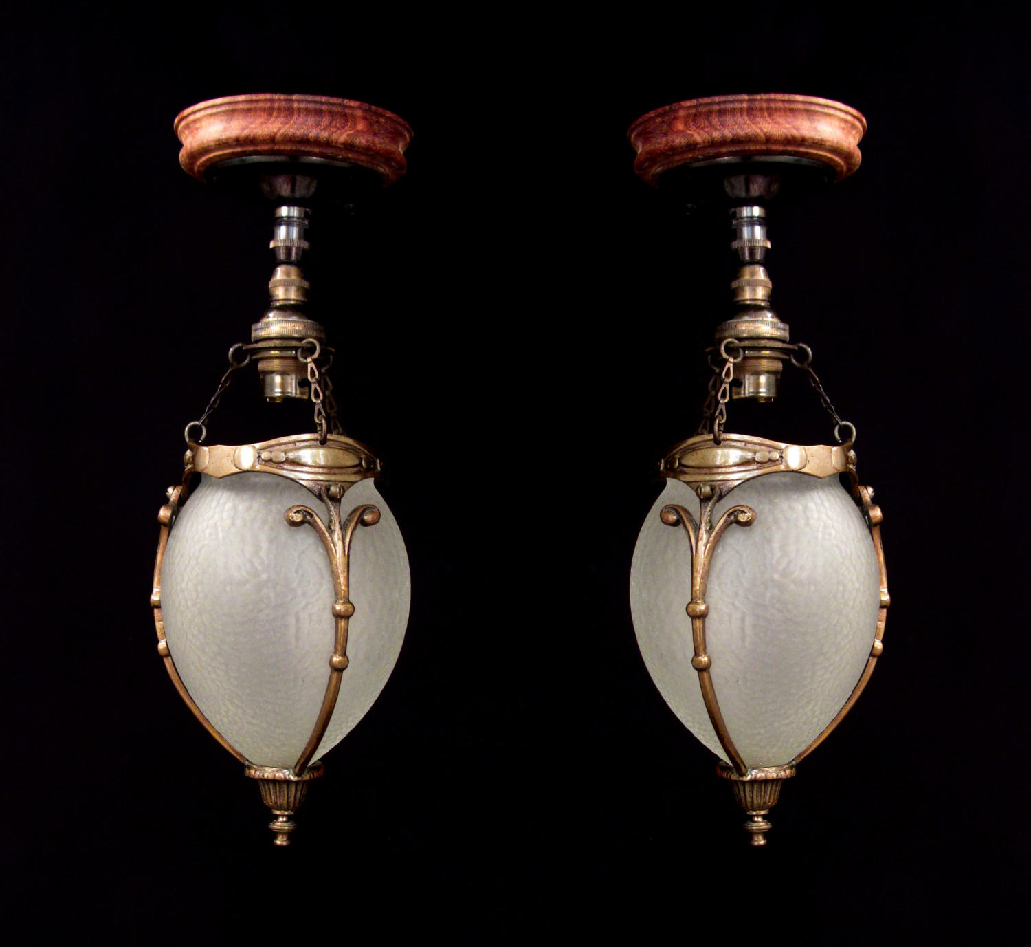 A pair of cut glass acorn lanterns