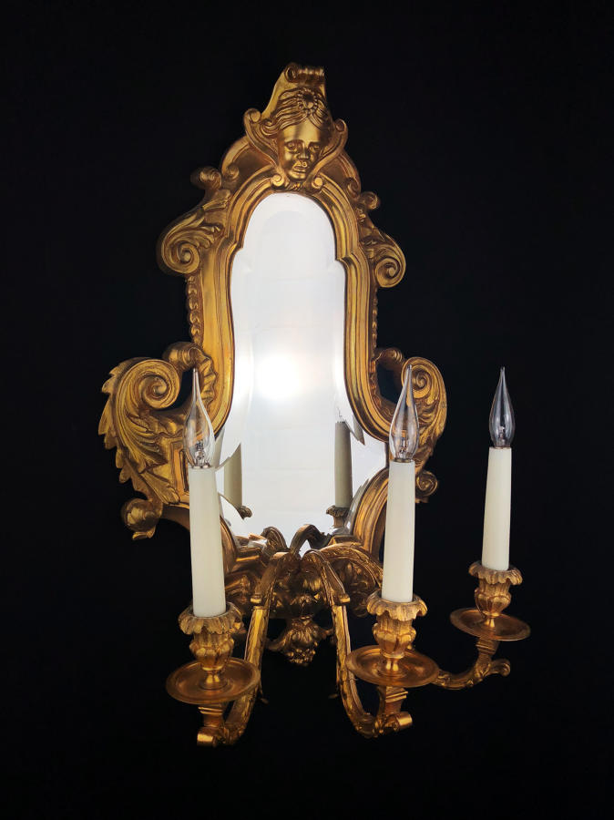 A Louis XVI style mirrored girandole