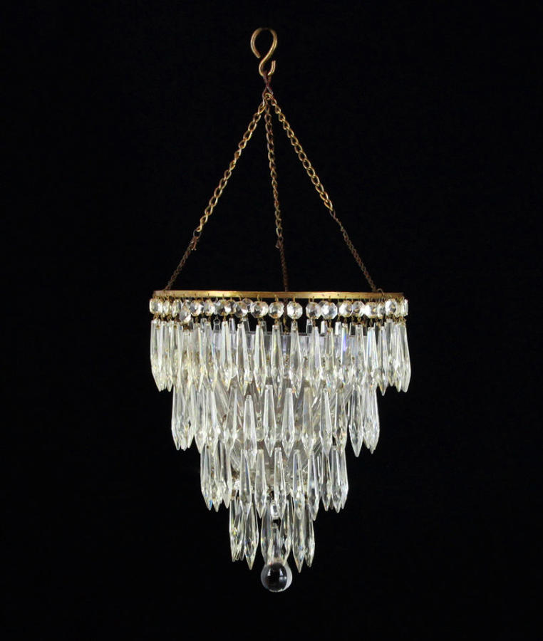 A three tier cut glass icicle drop chandelier