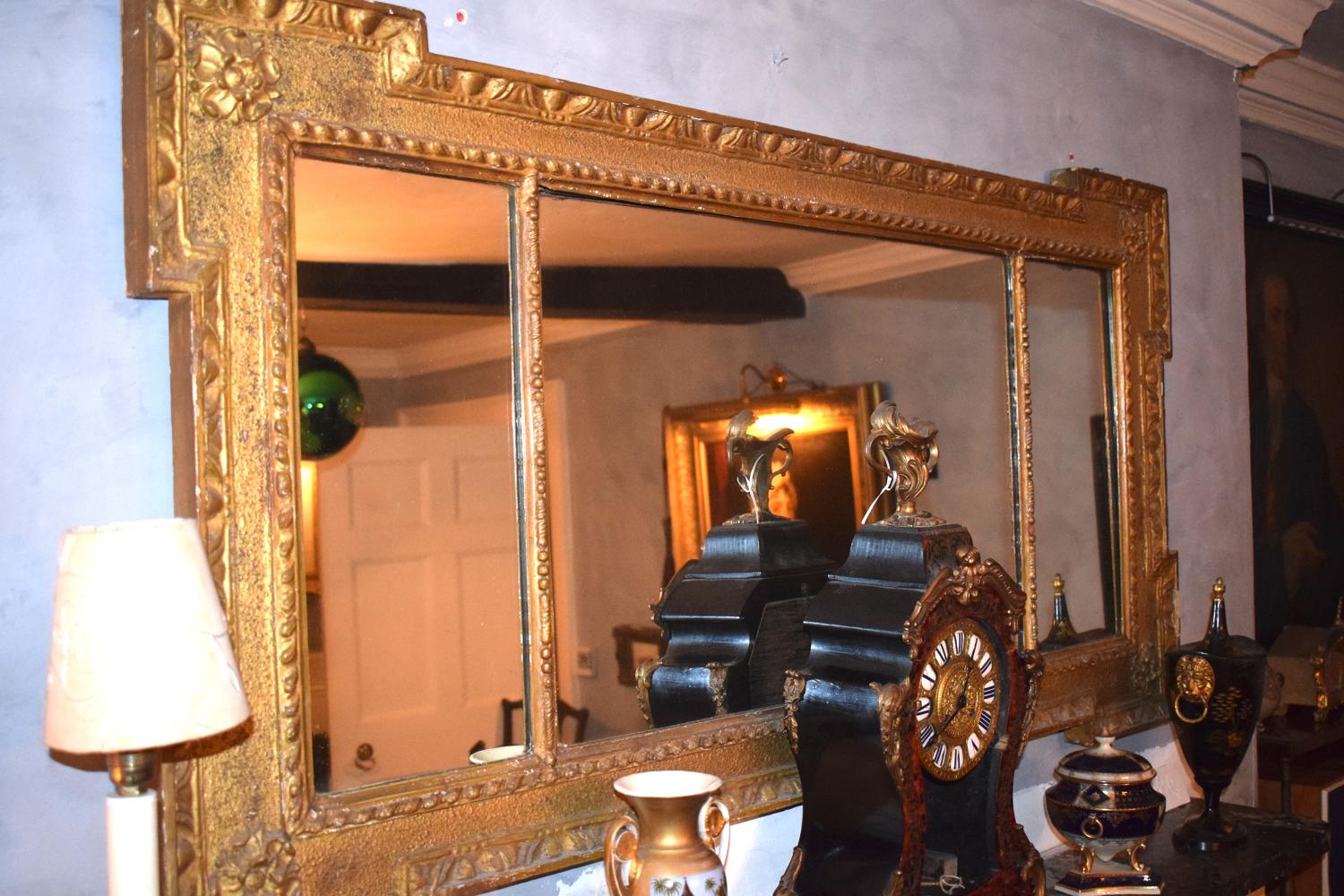An 18th century egg and dart mantel mirror
