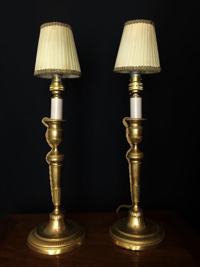 A pair of candlestick lamps