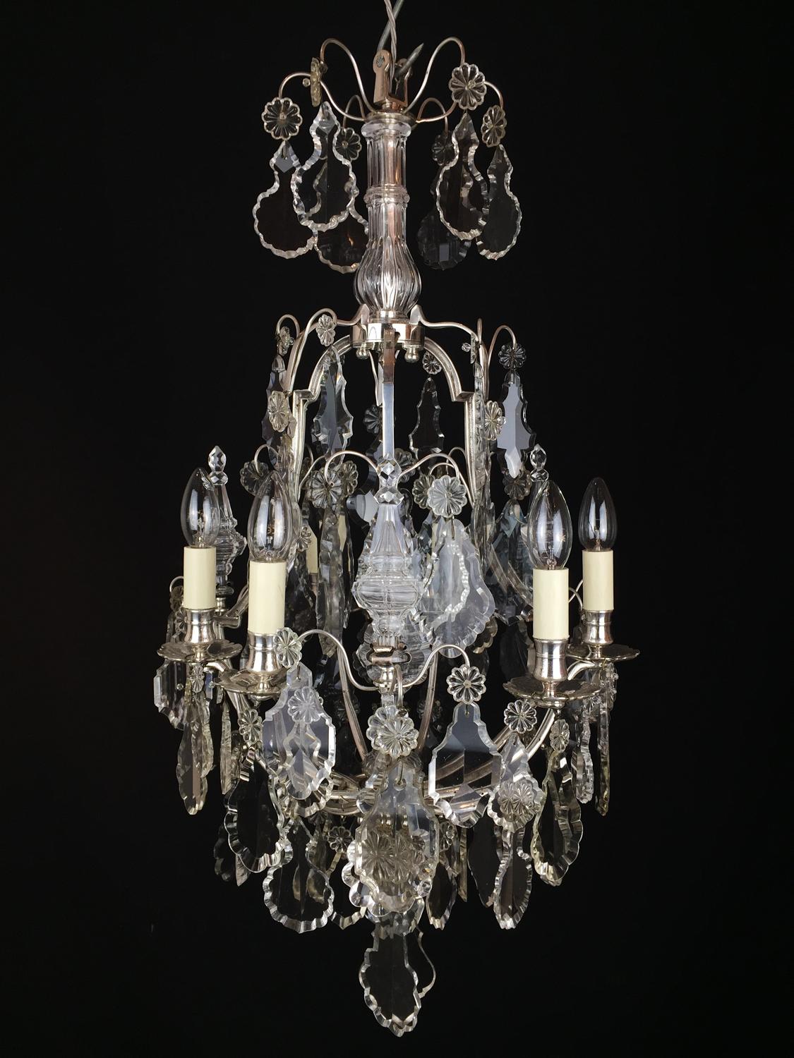 A French, silvered  brass six arm chandelier