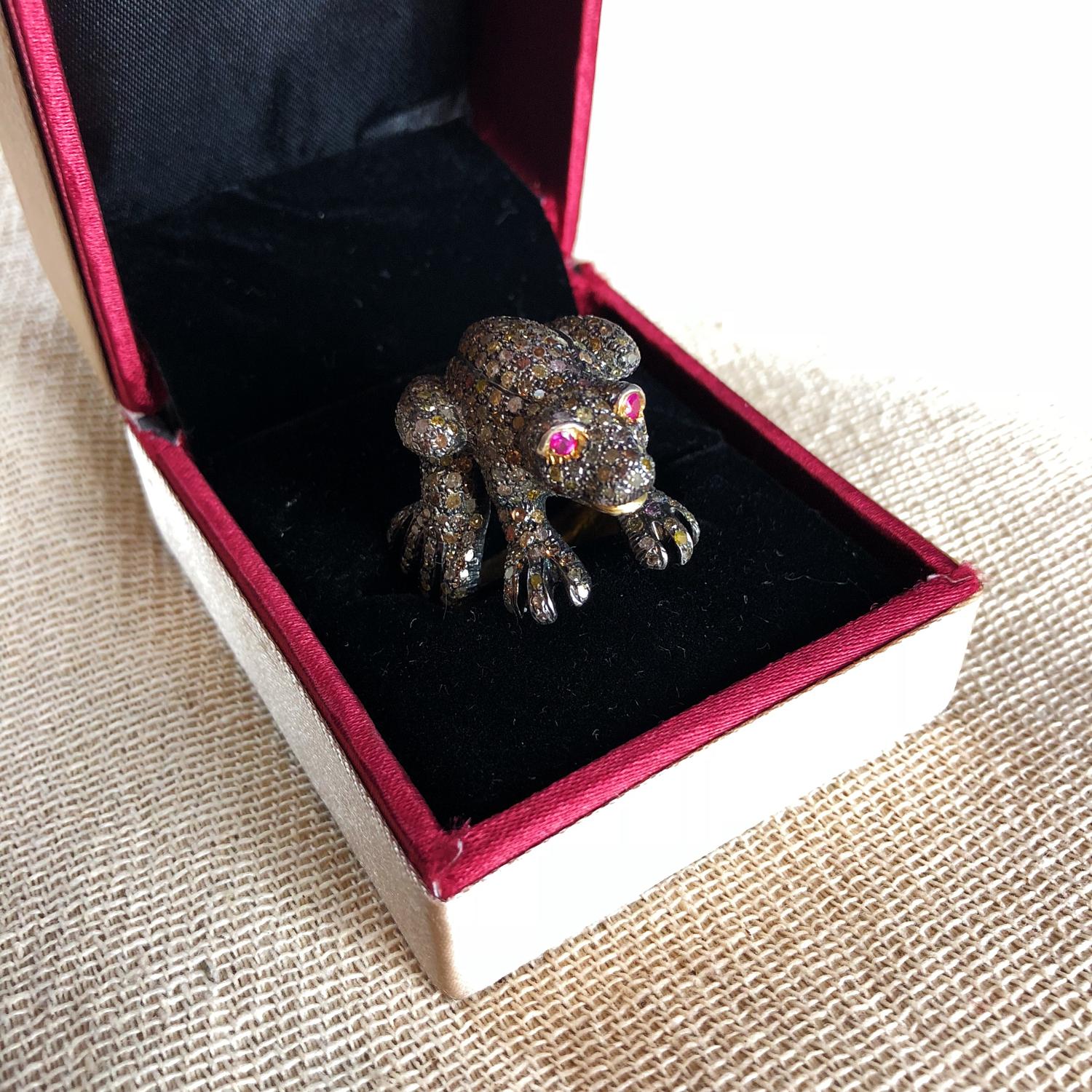 A charming frog ring with ruby eyes