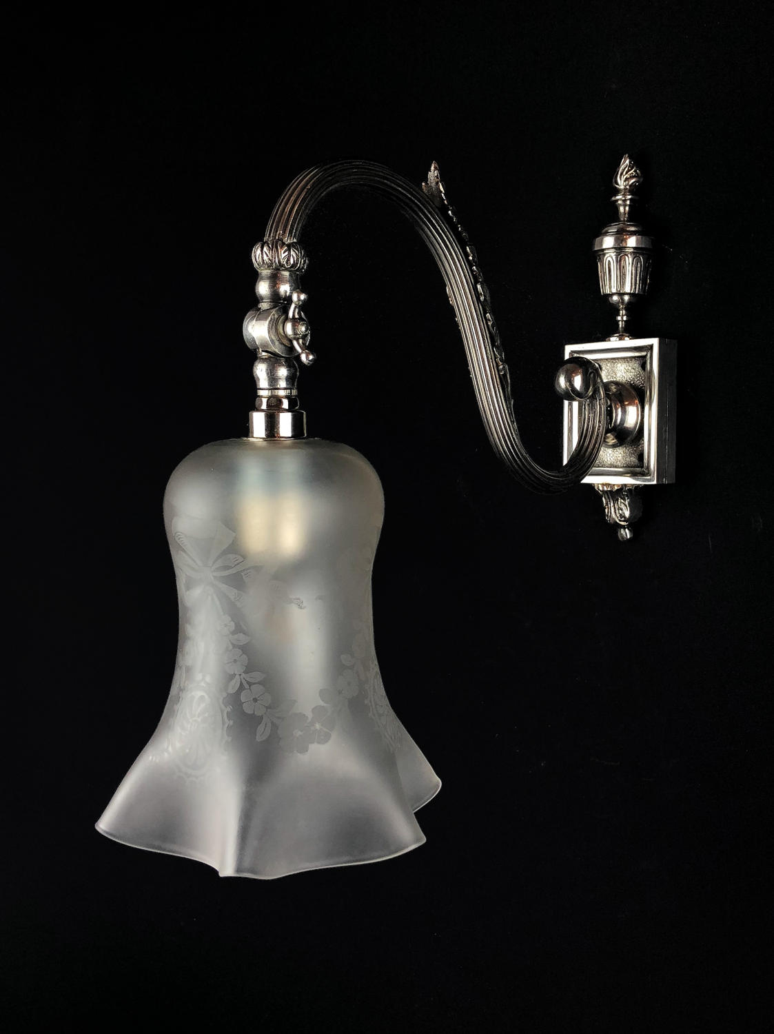A Silvered Single Wall Light With Frosted Shade