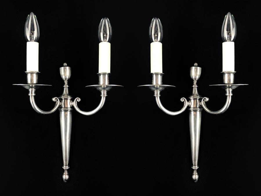 A set of four silvered two arm wall lights