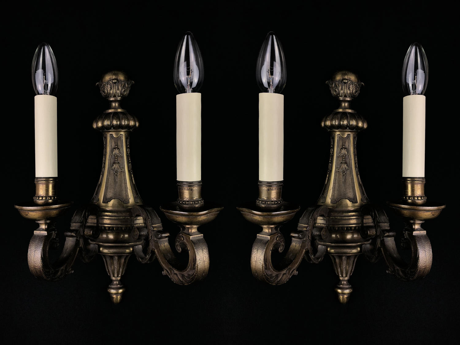 A set of four large Regency style wall lights