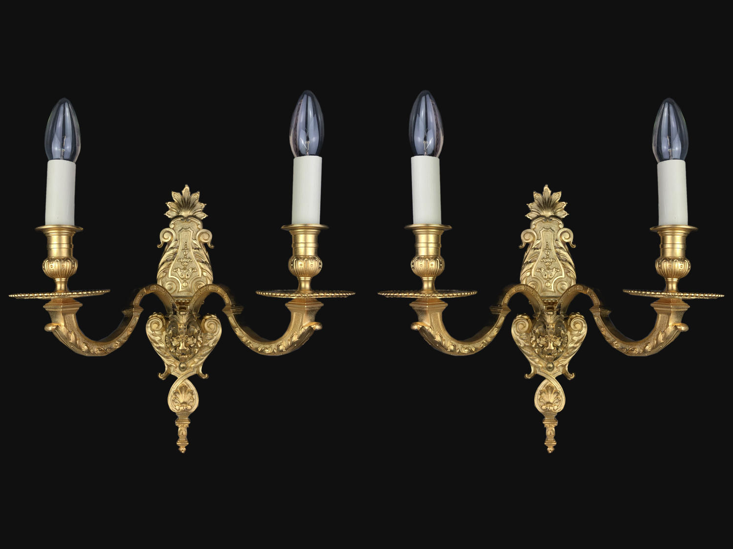A pair of gilt-bronze Louis XVI style wall lights