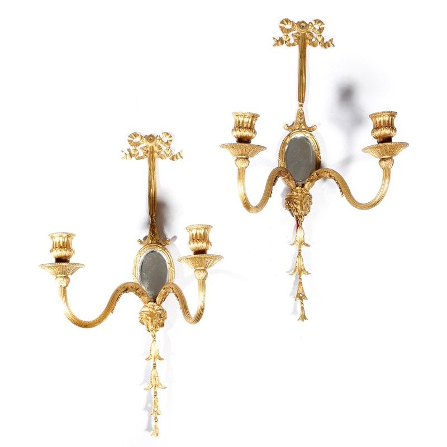 A pair of Ormolu Louis XVI style wall lights