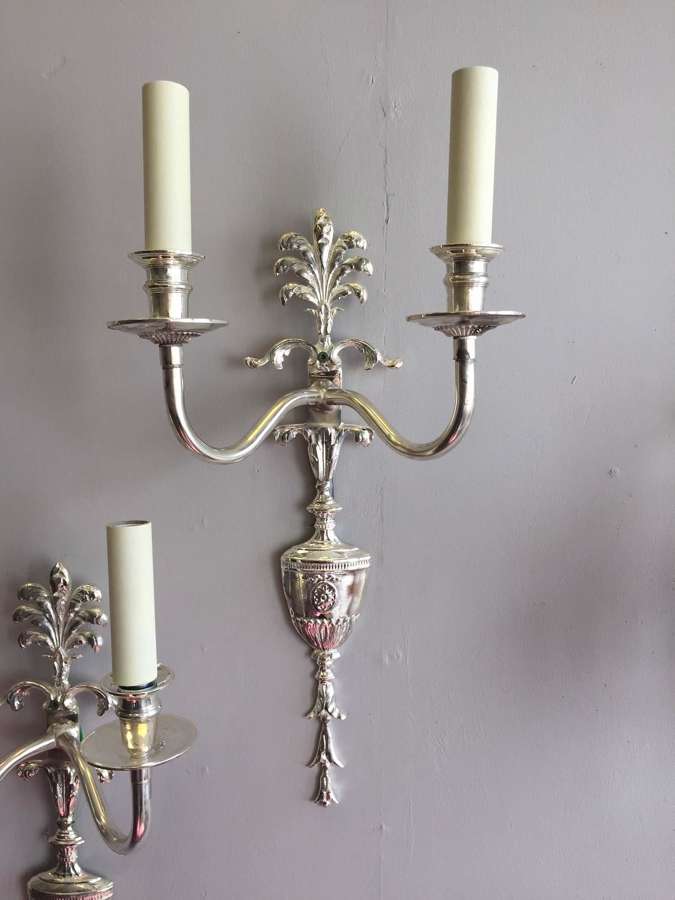 Four silvered Louis XVI style wall lights