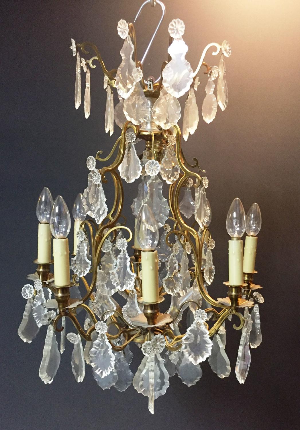 An eight arm gilt-brass and cut glass chandelier