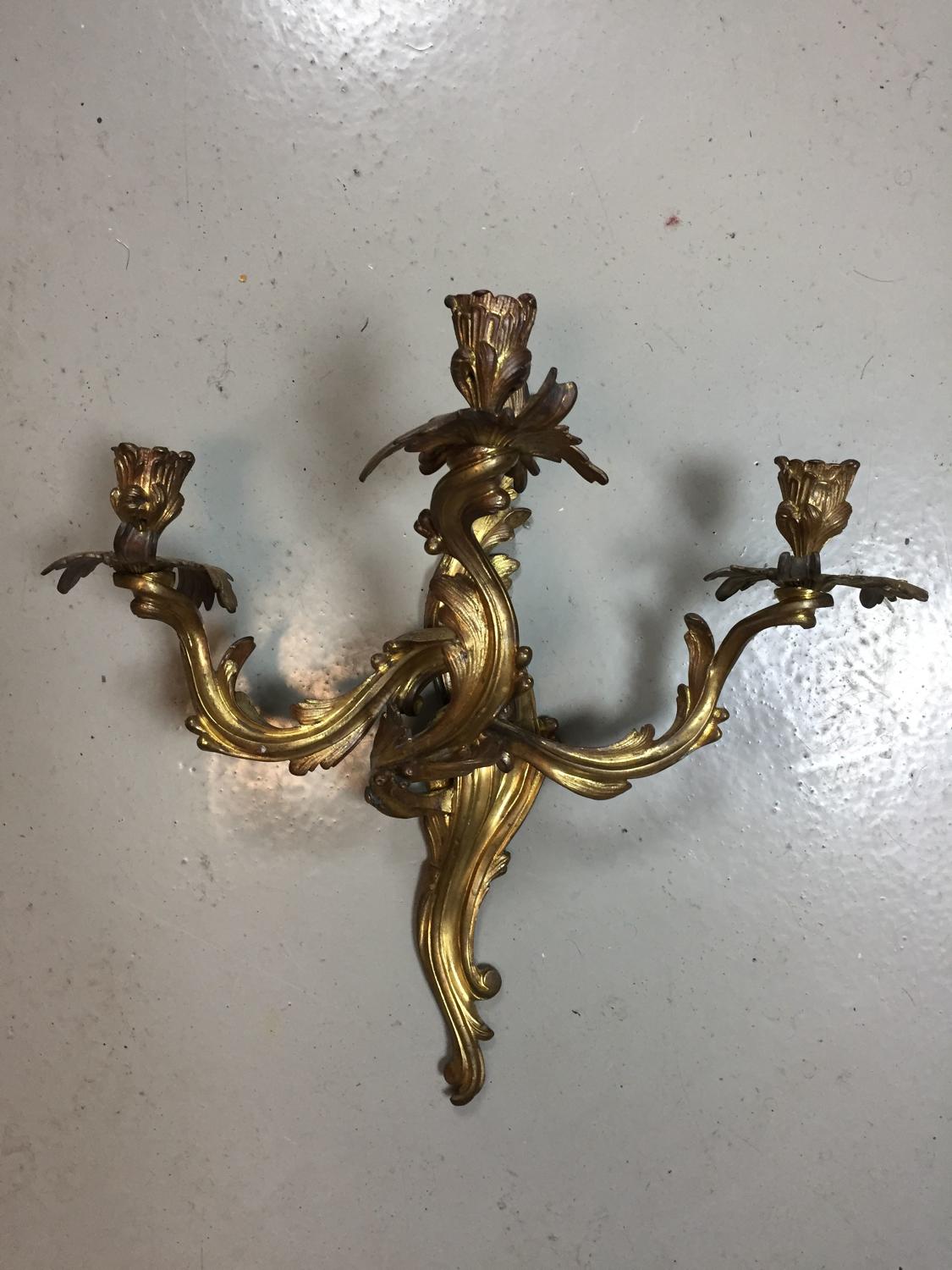 A pair of Rococo style wall lights