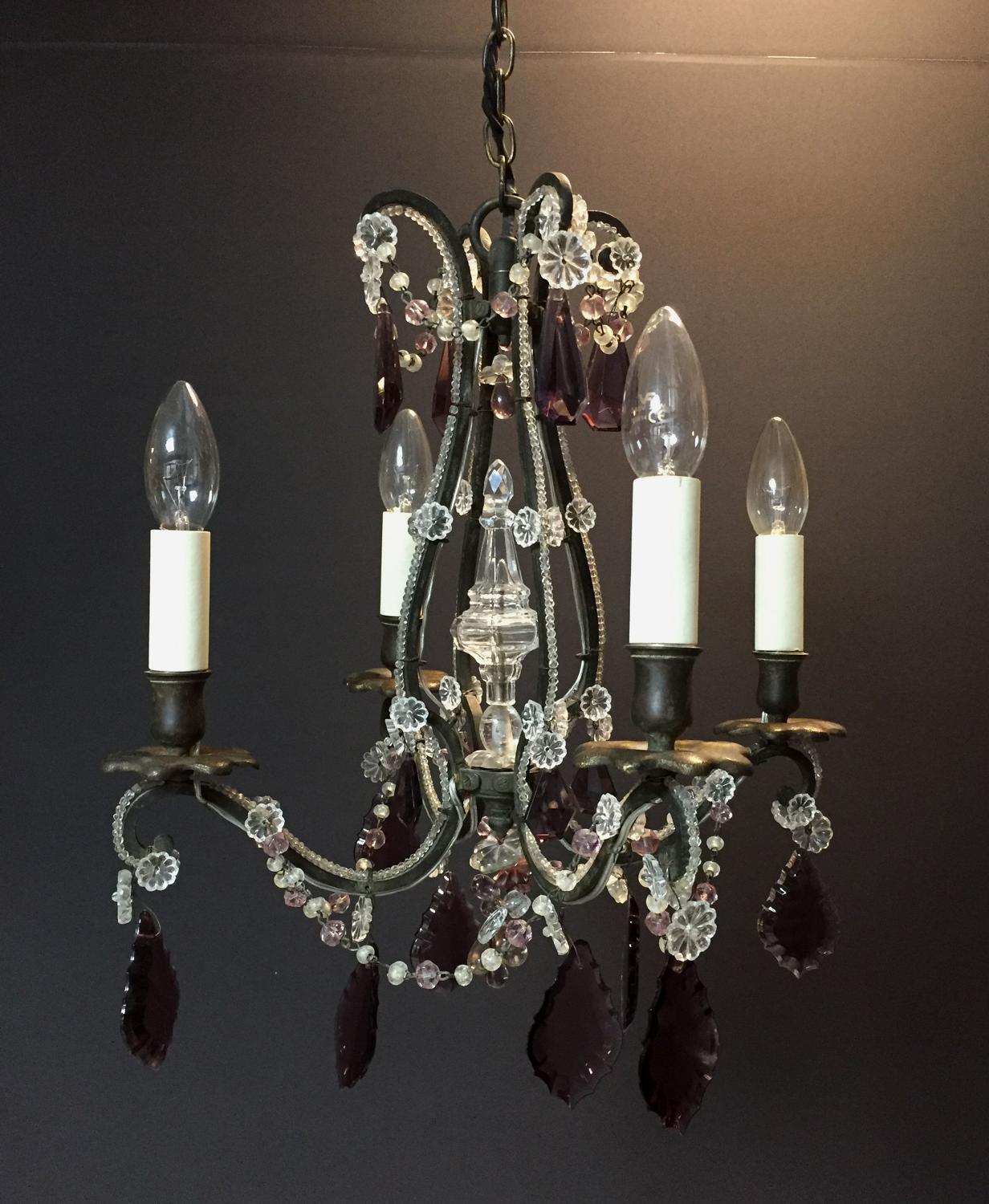 A charming black metal and amethyst chandelier