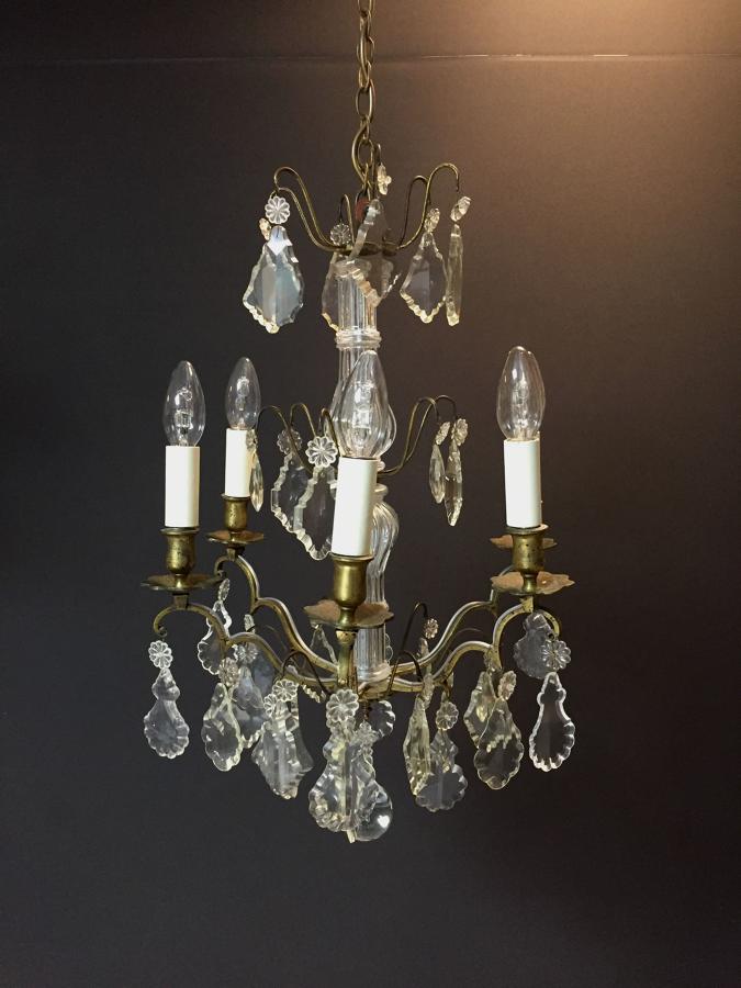A gilt-brass and cut glass six arm chandelier