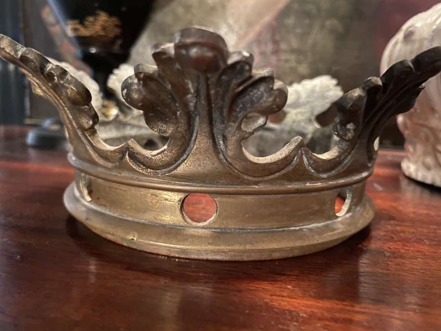 A cast brass or bronze crown