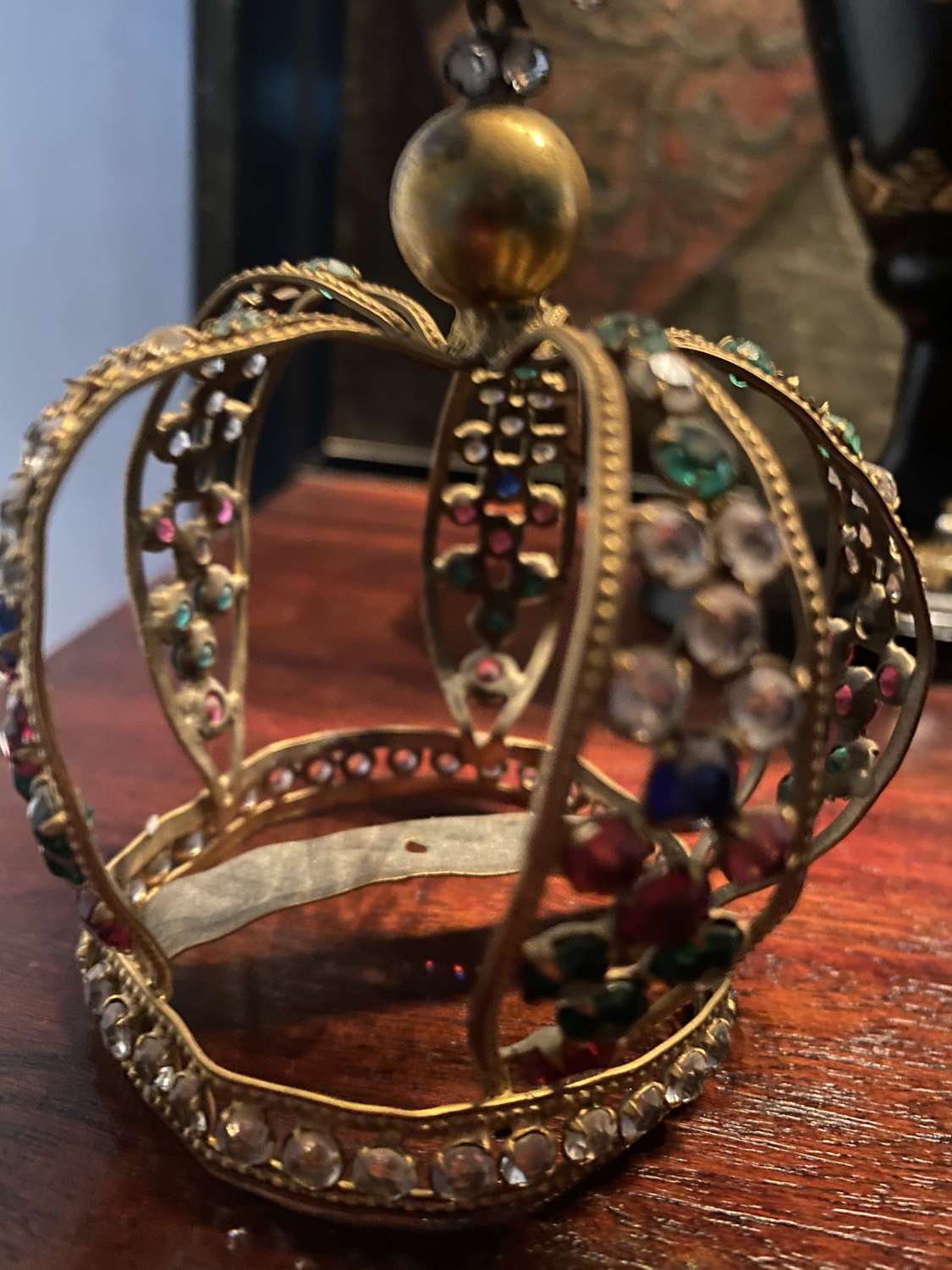 A small brass tiara sets with old cut glass diamonds