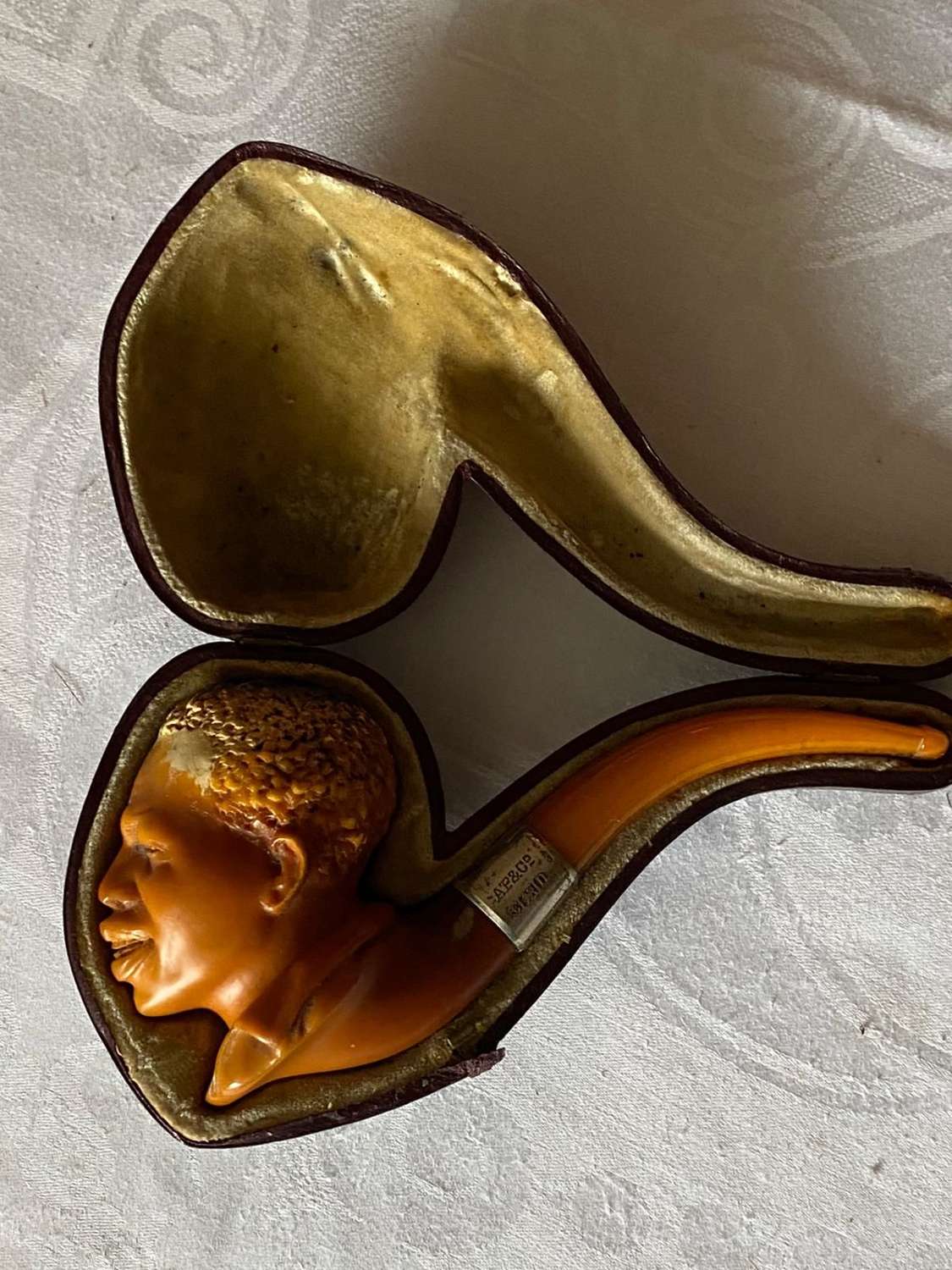 Meerschaum pipe stylised in a form of a negro with the original amber