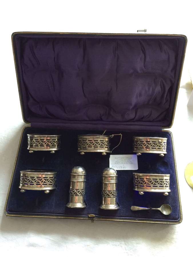 An set of silver salt and pepper holders