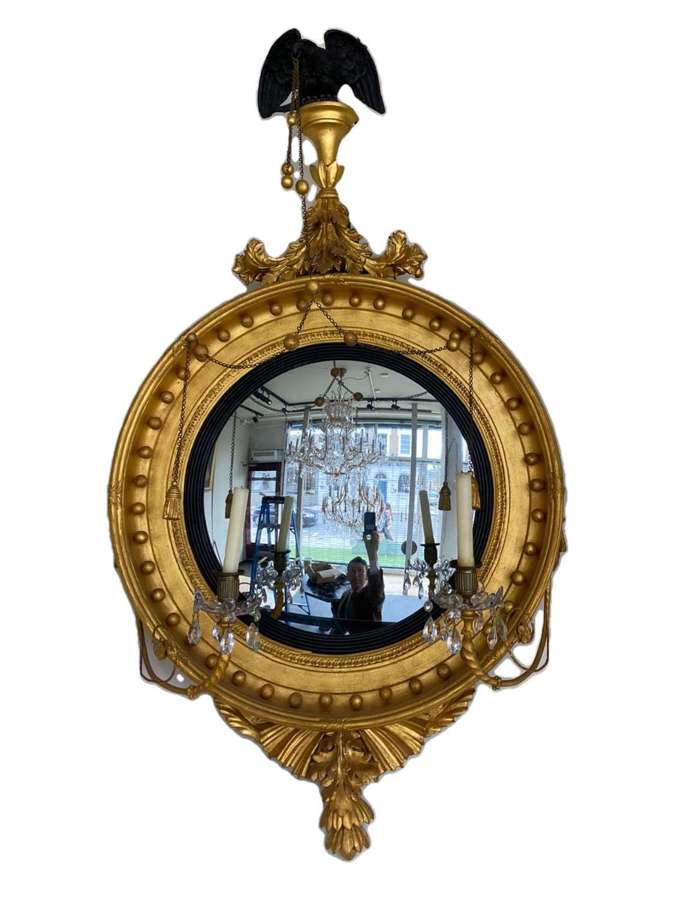 A Regency giltwood convex wall mirror