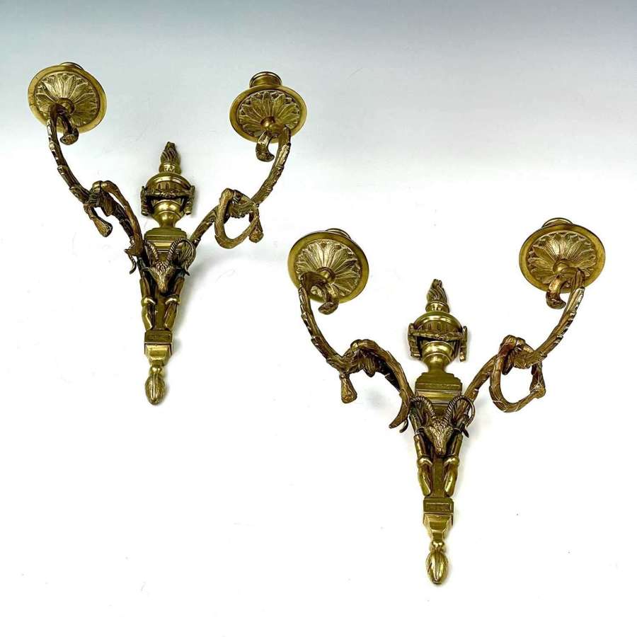 A pair of twin branch Empire style wall lights
