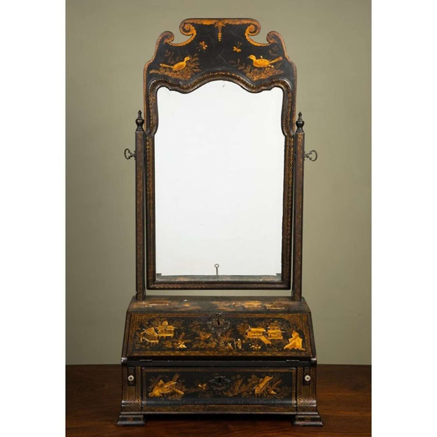 A George II chinoiserie black lacquered dressing table mirror