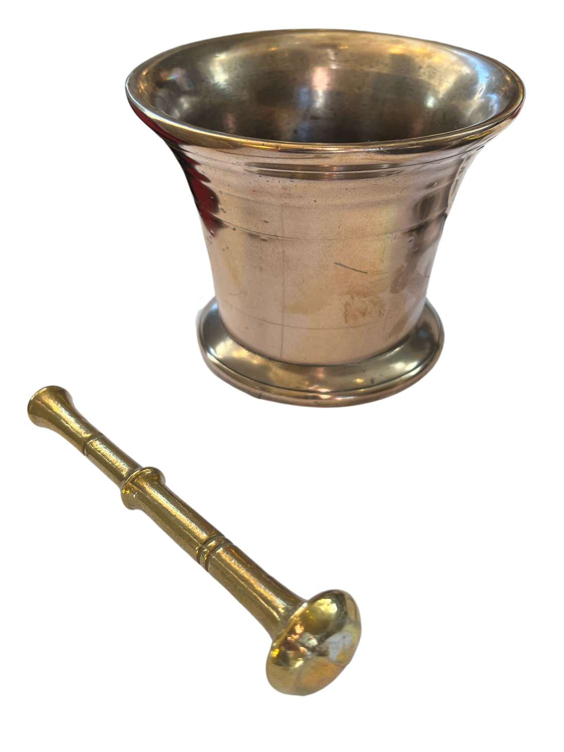 A solid brass pestle and mortar