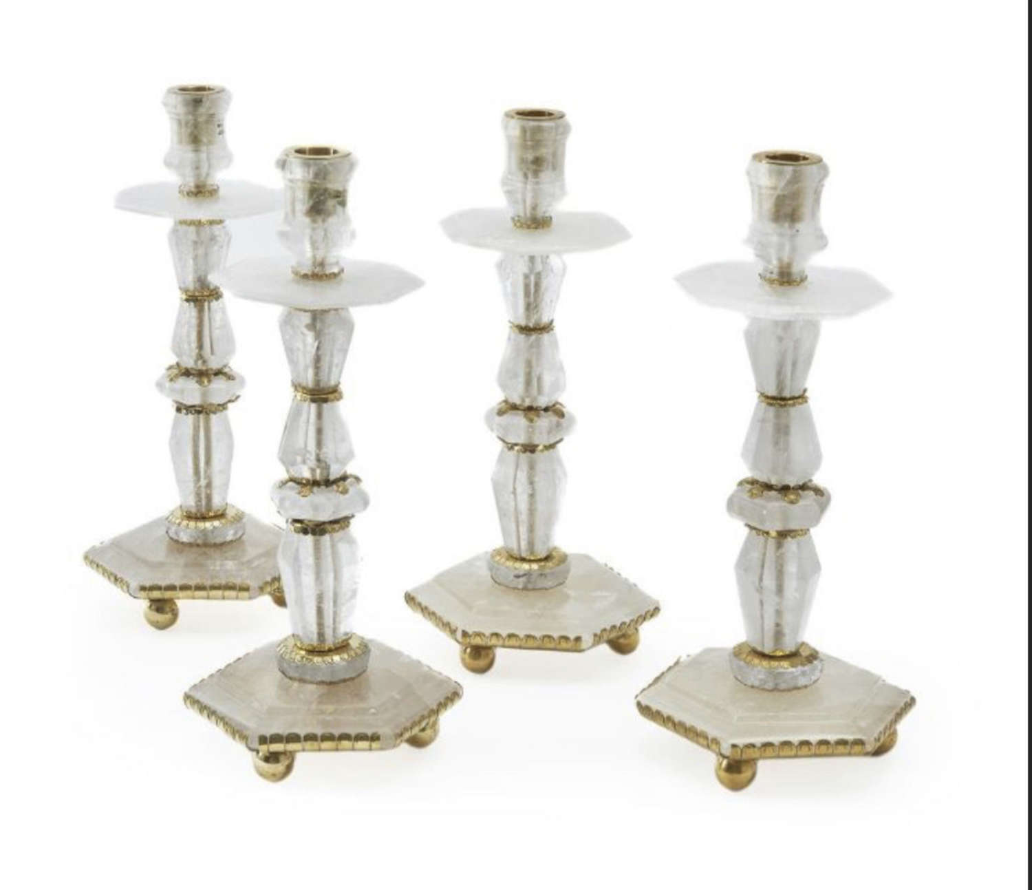 A SET OF FOUR BAROQUE STYLE ROCK CRYSTAL CANDLESTICKS