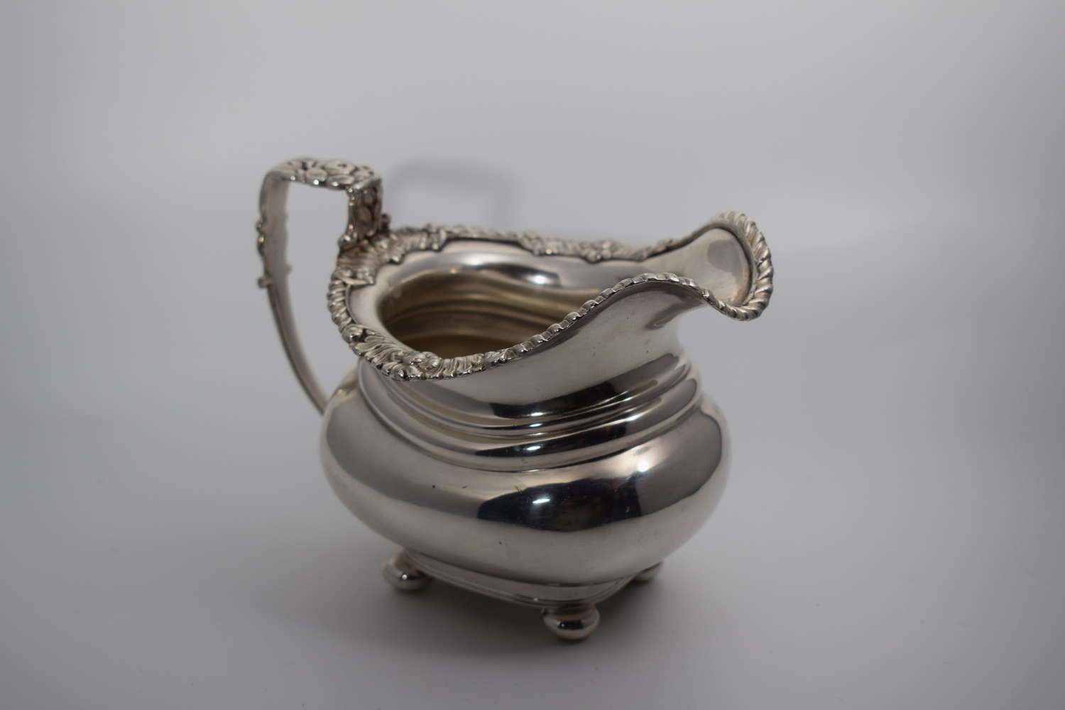 An 1820s silver plated cream jug