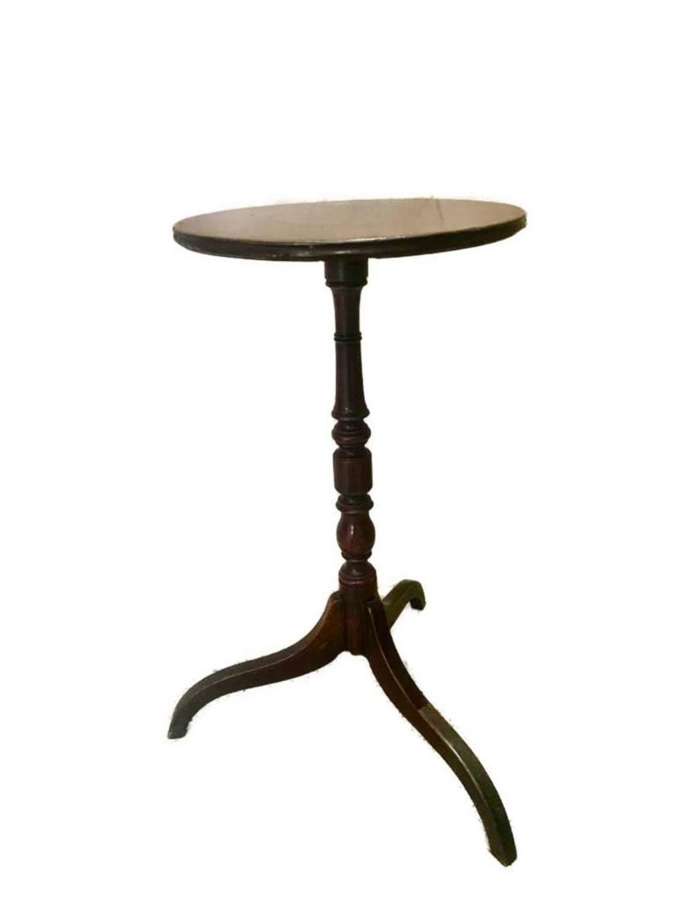 A small circular mahogany tripod table