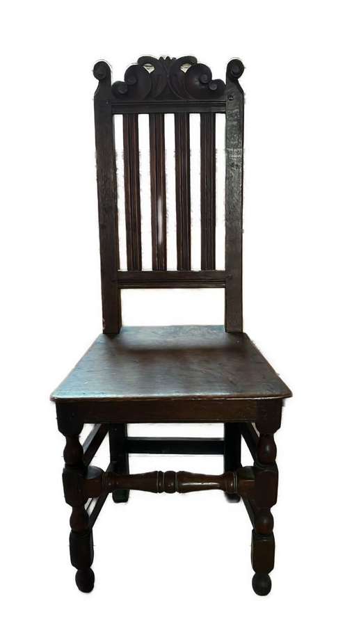 A oak high-backed chair