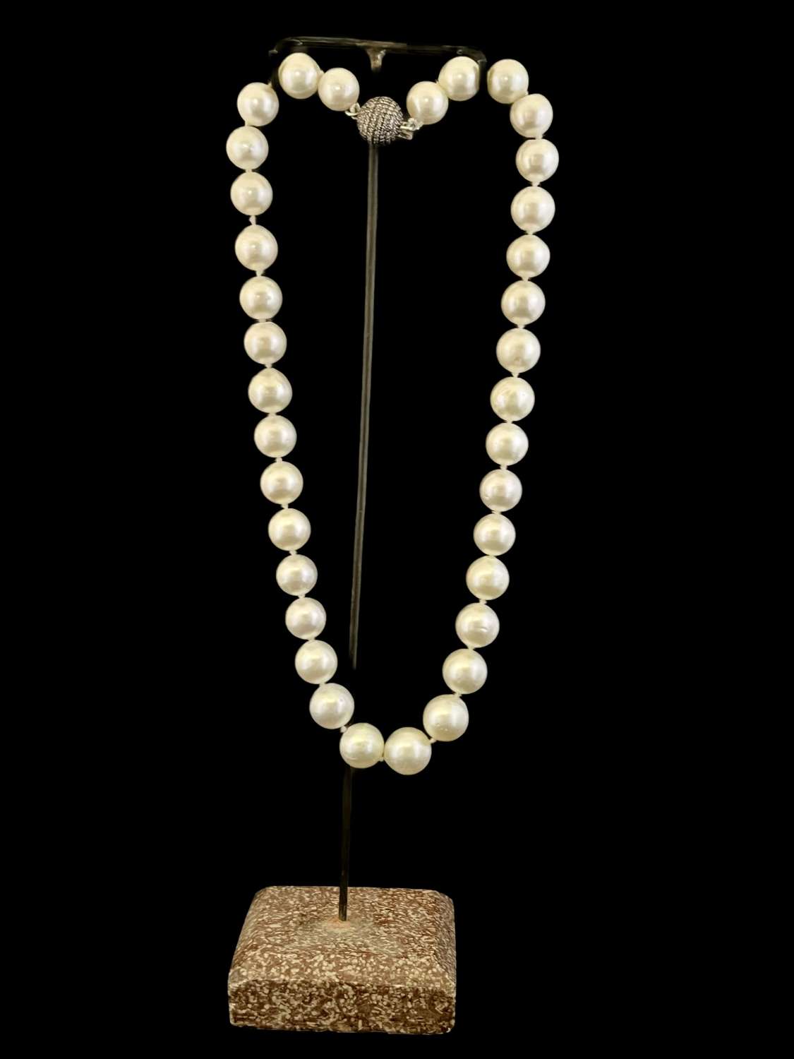 A Southsea pearl necklace with a pave diamonds and silver ball